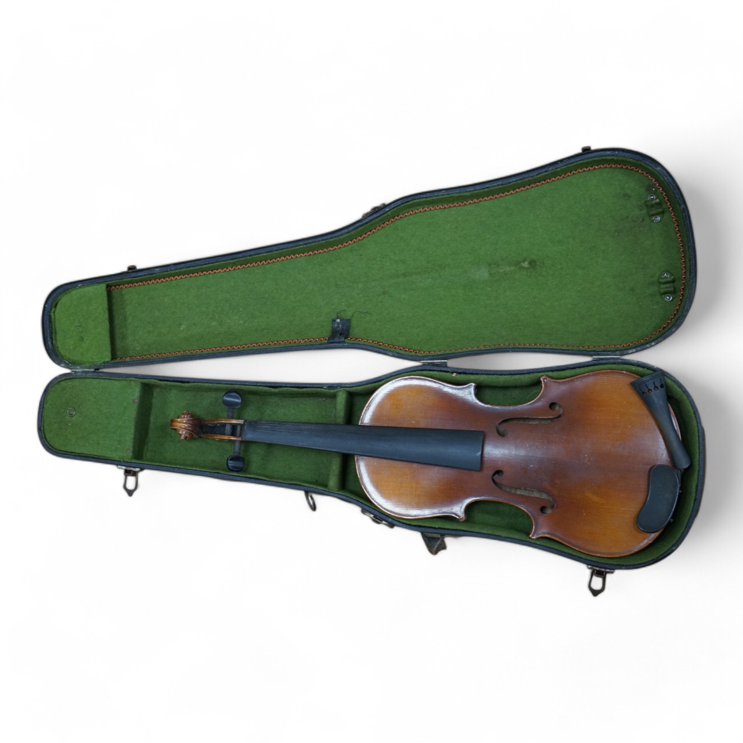 A cased three-quarter size 1920s Czechoslovakian violin, body length 33cm. Condition - fair to good.